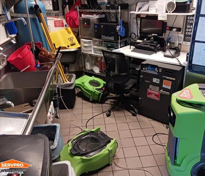 Drying equipment on a commercial kitchen floor.