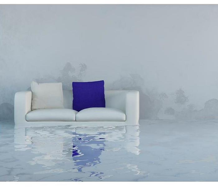 Flooded room with a floating couch.